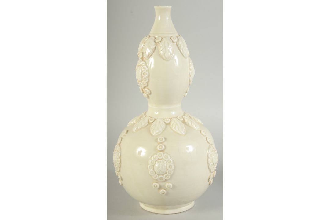 A CHINESE DING STYLE WHITE GLAZED DOUBLE GOURD VASE, with moulded decoration, 29cm high. - Image 2 of 11
