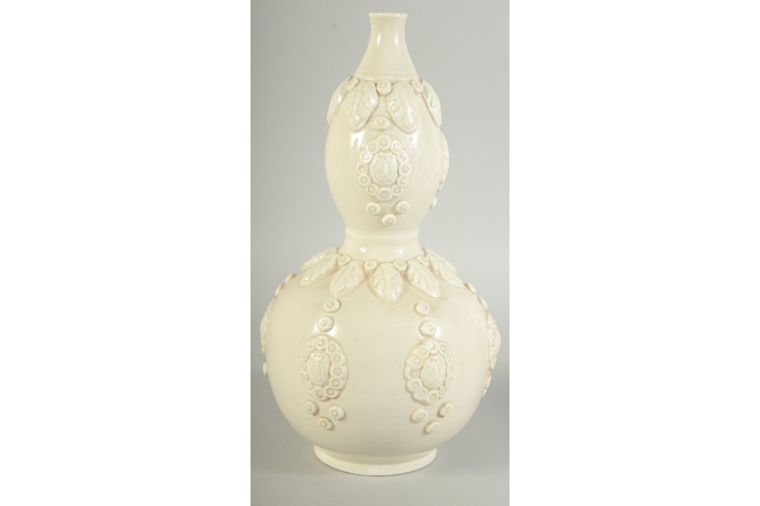 A CHINESE DING STYLE WHITE GLAZED DOUBLE GOURD VASE, with moulded decoration, 29cm high. - Image 1 of 11