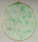 AN EARLY 20TH CENTURY JADEITE OVAL PENDANT, 6cm x 5cm.