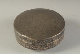 AN ISLAMIC NIELLO SILVER CIRCULAR BOX ENGRAVED WITH TUGHRA, hallmarked to base, 11cm diameter.