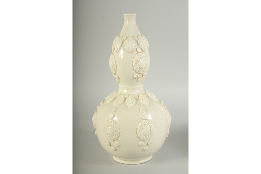 A CHINESE DING STYLE WHITE GLAZED DOUBLE GOURD VASE, with moulded decoration, 29cm high. - Image 8 of 11