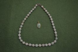 A jade bead necklace.