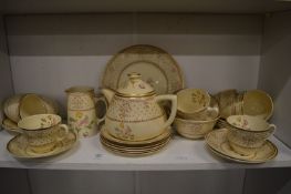 Clarice Cliff at Wilkinson Ltd, a floral decorated tea service.