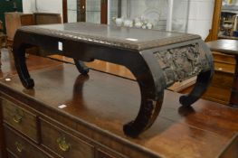 A Chinese carved hardwood low table.
