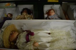 Three large boxed collectors dolls.