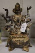 An Eastern cast metal multi-armed Deity.