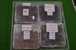 Four boxes of colourful stones.