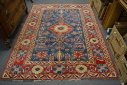 A good Persian design rug, rich blue ground with stylised decoration, 240cm x 180cm.