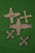 small bronze crucifixes.