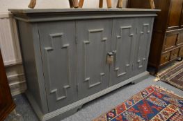 An Oka duck egg blue painted cupboard with pair of bifold doors.