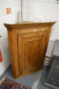 A 19th century pine hanging corner cupboard.