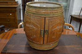 An unusual barrel shaped bottle holder.