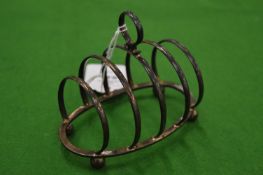 A silver toast rack.