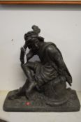 A large cast spelter figure of Hamlet in thoughtful pose, seated on classical ruins.