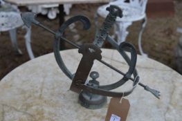 A small bronze sundial.