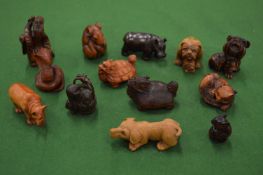 A collection of carved hardwood netsukes.