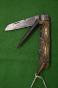 A sailors pocket knife with carved bone grip, large single blade and a marlin spike.