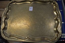 An Eastern engraved brass tray.