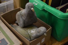 A pair of carved wood and painted pigeon decoys.