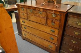 A George III mahogany chest of drawers with secretaire central drawer (faults).