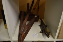 A cast metal crocodile nut cracker and a pair of wooden wall brackets.