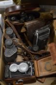 Old cameras and binoculars.