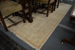 An Afghan Chobi, beige ground with stylised decoration, 275cm x 188cm.