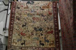 A good Persian design carpet, beige ground with an allover design of numerous sylised animals, 245cm
