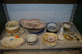 A shelf of decorative china.