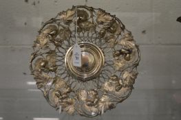 An ornate metal dish.