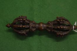 A Tibetan bronze Vajra.
