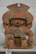 A large pre Columbian style pottery seated figure.