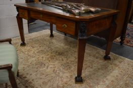 A French Revival mahogany desk with black leather inset writing surface, three frieze drawers