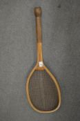 An early tennis racket.