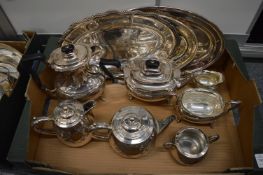 A plated four piece tea service, three piece tea service and three oval trays.