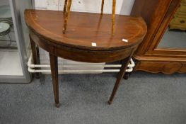 A 19th century mahogany D shaped fold-over tea table.