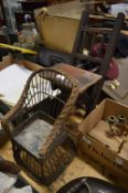 A miniature wicker chair and a miniature folding chair.