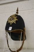 First Battalion Herefordshire Regiment helmet with chin strap, applied decorative badge,