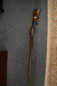 A double barreled German percussion sporting gun, 16 bore with carved stock.