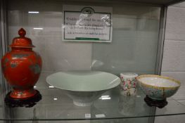 A Chinese baluster shaped jar and cover, a large celadon glazed bowl with incised decoration, an