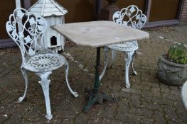 A marble top table with cast iron base together with a pair of aluminium chairs.