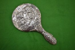 A silver backed dressing table mirror.