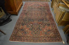 A good Persian carpet, early 20th century, blue ground with floral decoration, 295cm x 155cm.