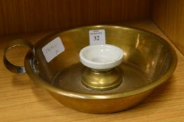 A brass chamber stick.