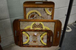 Three inlaid wood twin handled trays with butterfly wing decoration.