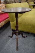 A 19th century mahogany circular tilt-top tripod table.