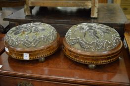 A pair of Victorian inlaid walnut circular foot stools with bead work upholstery.