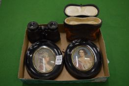 A pair of framed silhouettes and pair of opera glasses with case.