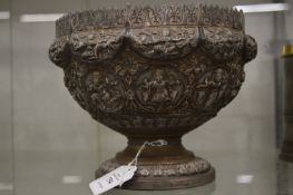 An Eastern white metal pedestal bowl with embossed decoration.