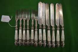 A set of six mother of pearl handled plated dessert knives and forks.